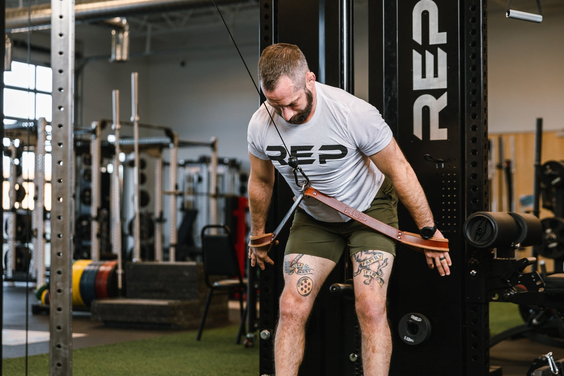 Man lifting with a long accessory strap