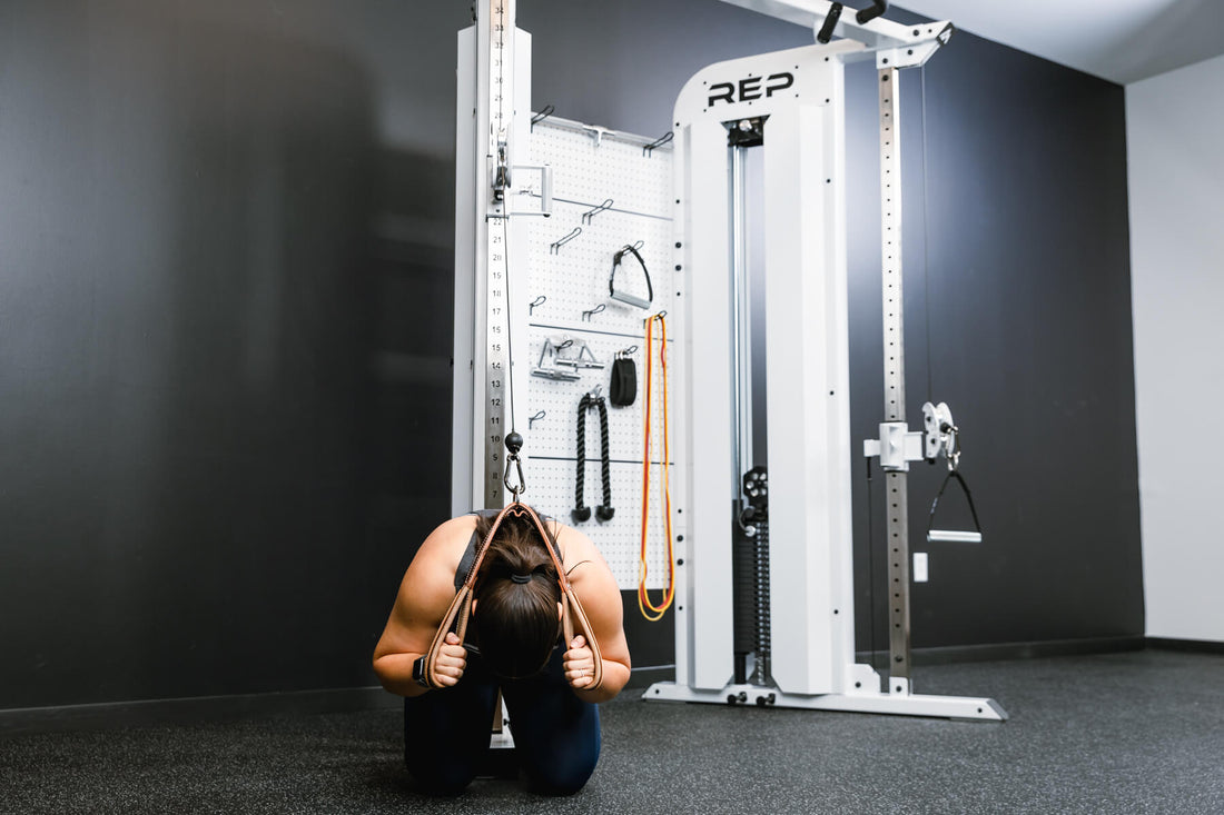 Athlete does a cable crunch on the Arcadia Max.