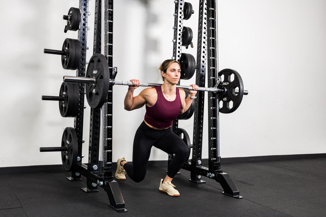 An athlete does a Smith machine lunge with the REP® Smith Machine attachment.