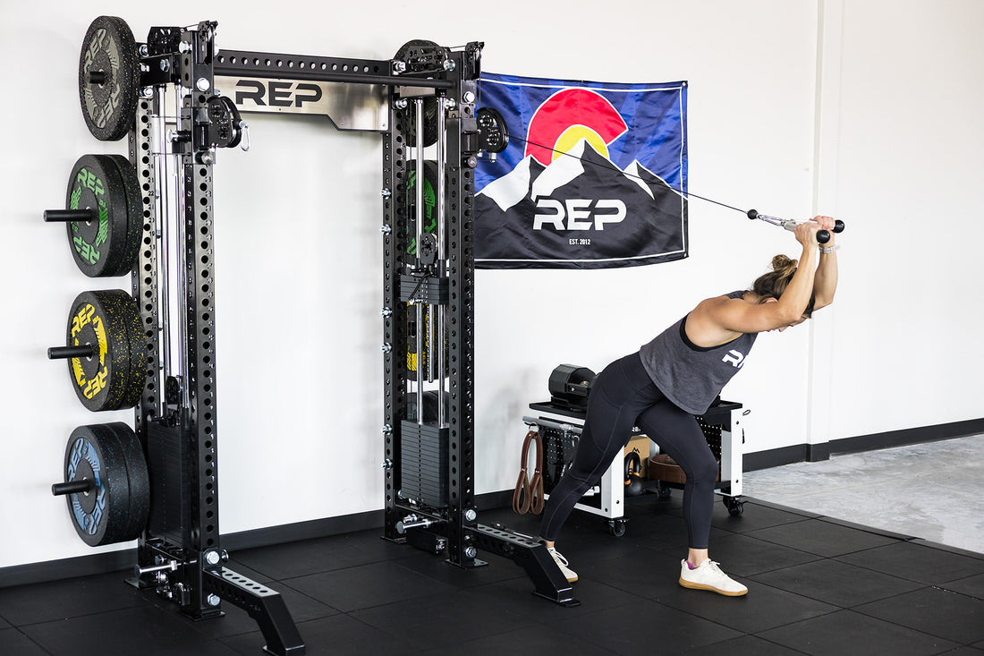power rack with front foot extension pair 2.0 adding stability to front of rack while someone use cable machine attachment for tricep extensions