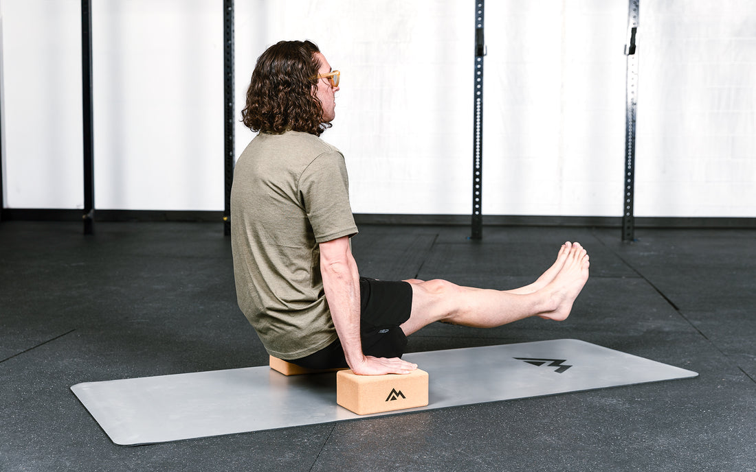 An athlete balancing on cork yoga blocks