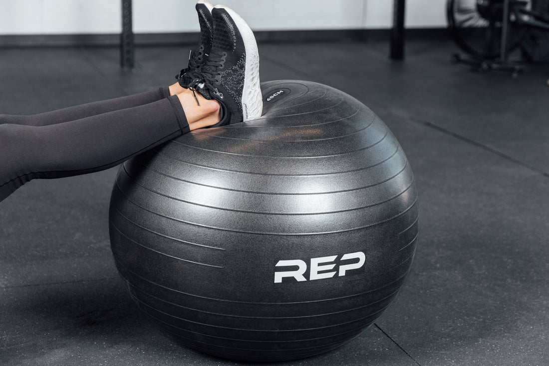 Up close shot of feet on the Physioball while an athlete does hamstring curls.