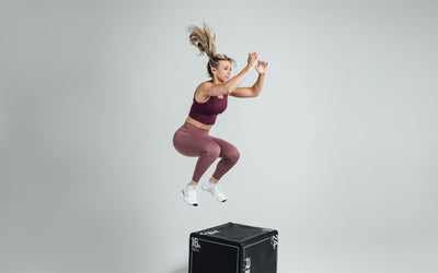 The REP Fitness Women's Rhea Cropped Tank Top in Wine front, box jump