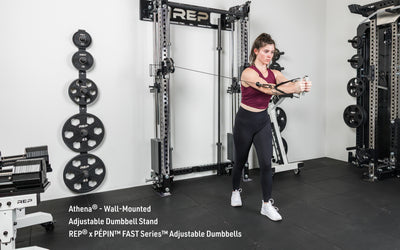 An athlete doing a cable fly exercise on the Wall-Mounted Athena rack