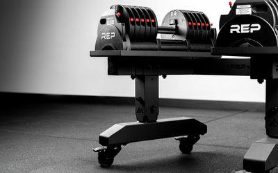 The REP QuickDraw™ Adjustable Dumbbells stored on the REP® Adjustable Dumbbell Stand.