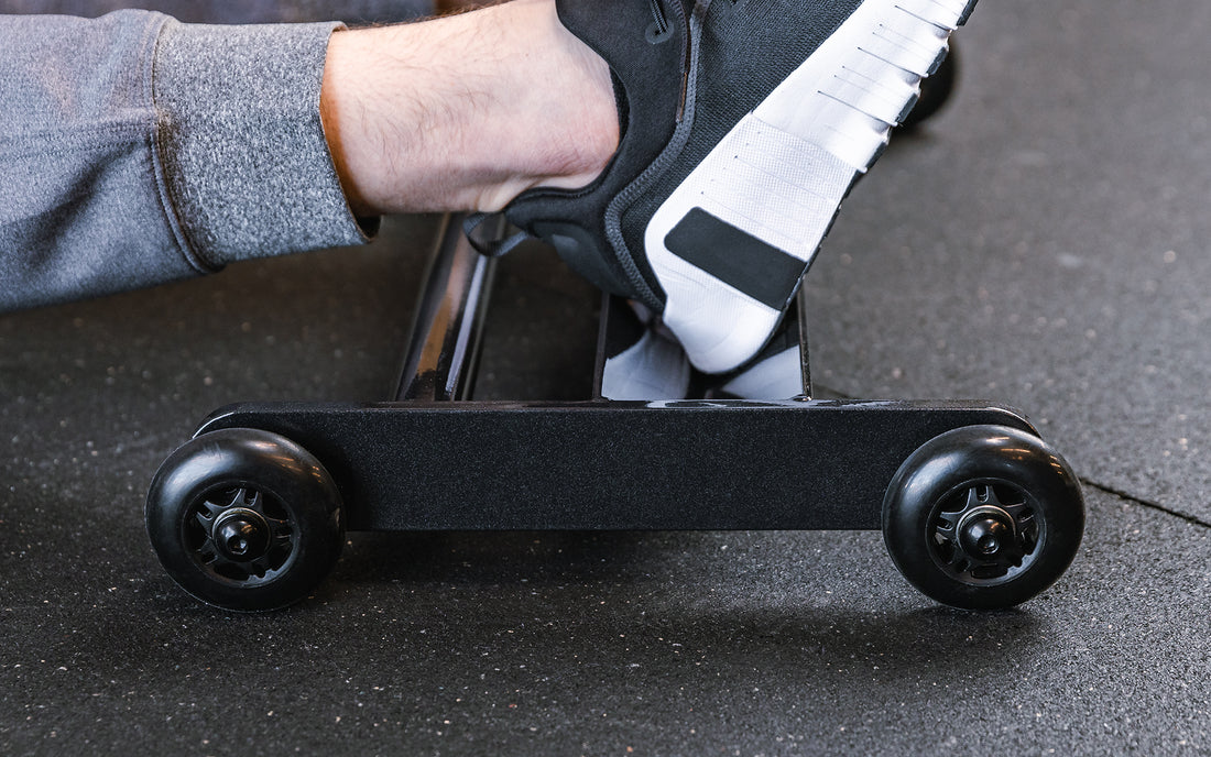 close up of feet on the foot tray of the glute ham roller