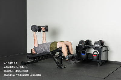 An athlete decline benching with the Quickdraw adjustable dumbbells on the AB-3000 2.0 adjustable bench