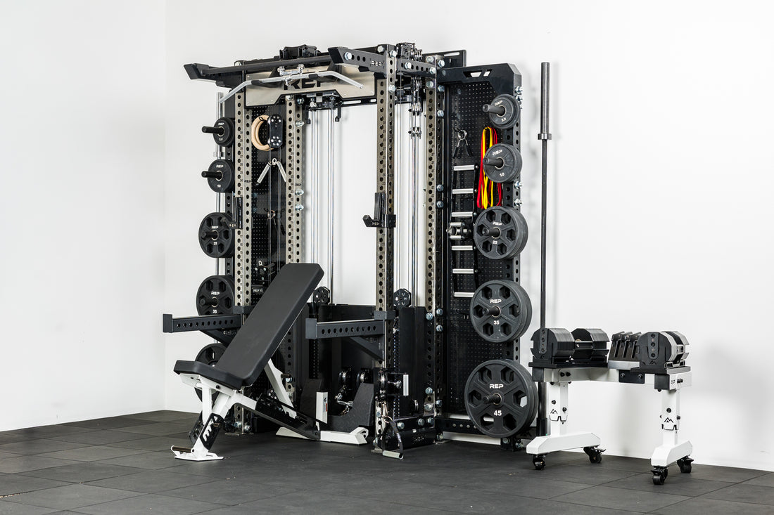 The REP Fitness Compact Home Gym Setup with the Wall-Mounted Ares 2.0, Nighthawk adjustable bench, and Equalizer™ Urethane-Coated Plates