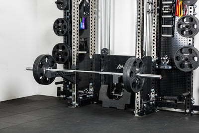 The Colorado barbell loaded with Equalizer™ Urethane-Coated Plates resting on spotter arms off the front of the Wall-Mounted Ares 2.0
