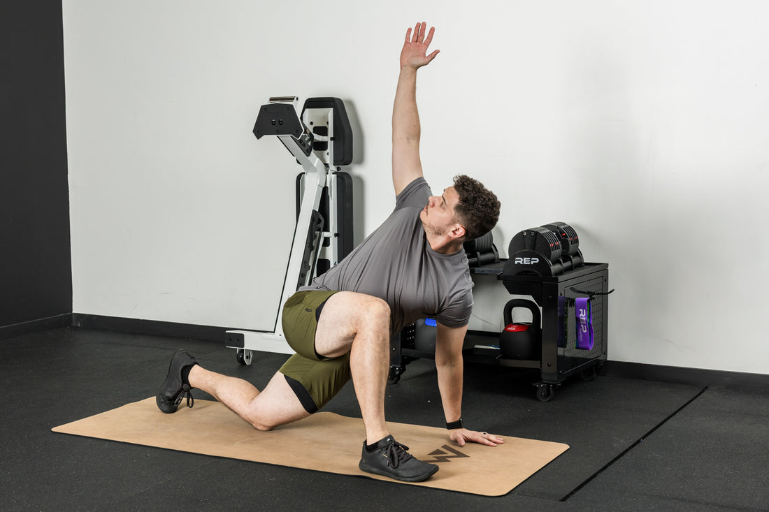 An athlete stretching on the REP premium cork yoga mat