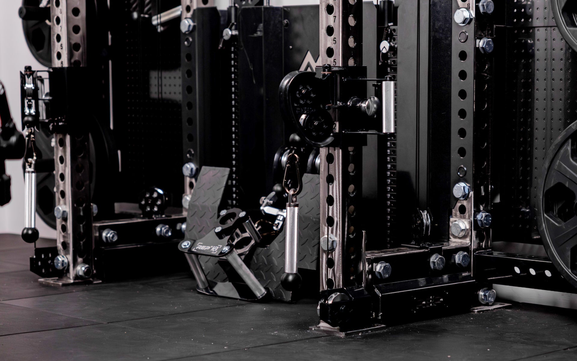A pair of REP® x Kleva Built® ISO Pushdown Grip Cable Attachments installed on a REP Ares™ 2.0