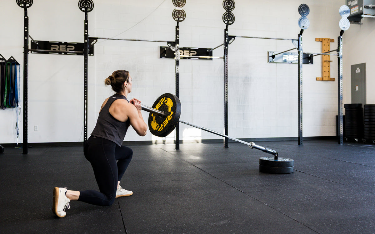 An athlete performing lunges with the Free Standing REP® x Kleva Built® Adroit Landmine