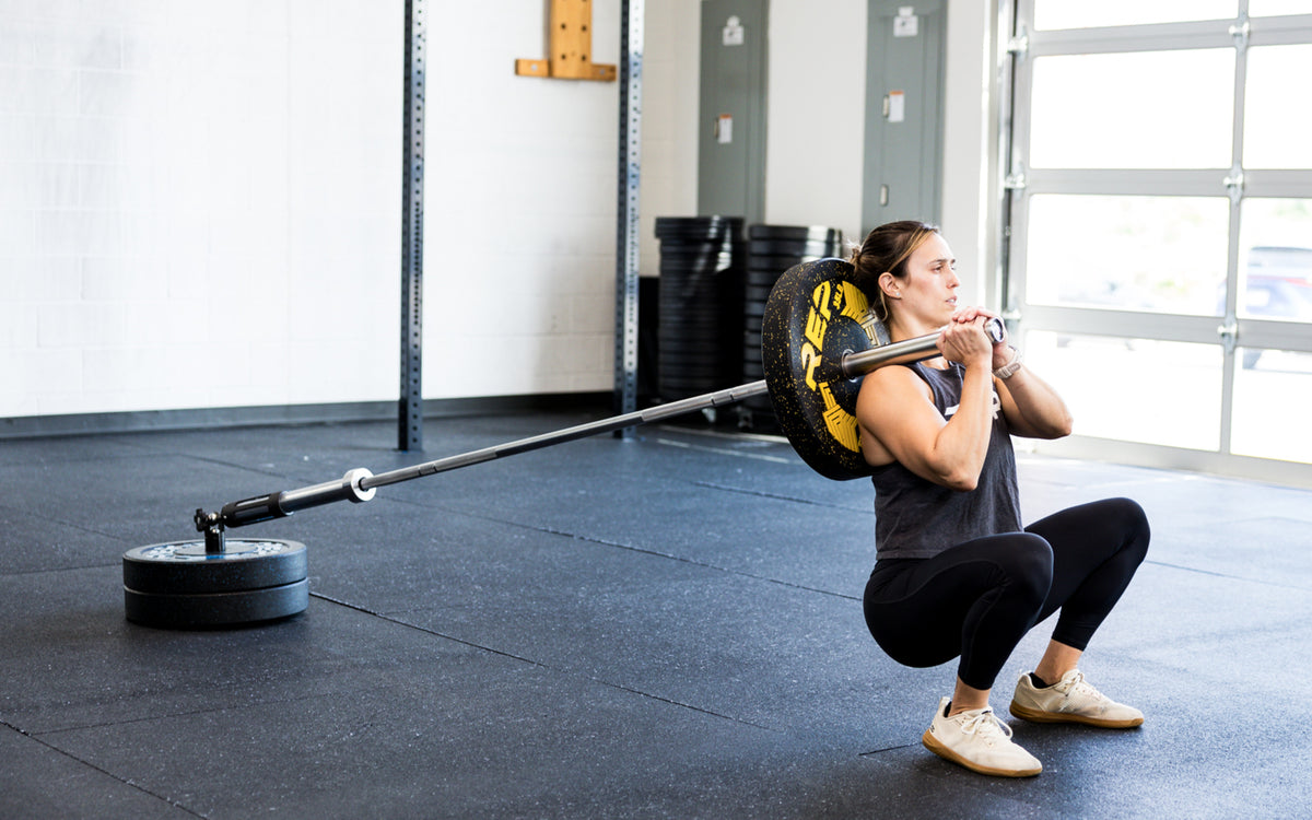 An athlete performing squats with the Free Standing REP® x Kleva Built® Adroit Landmine