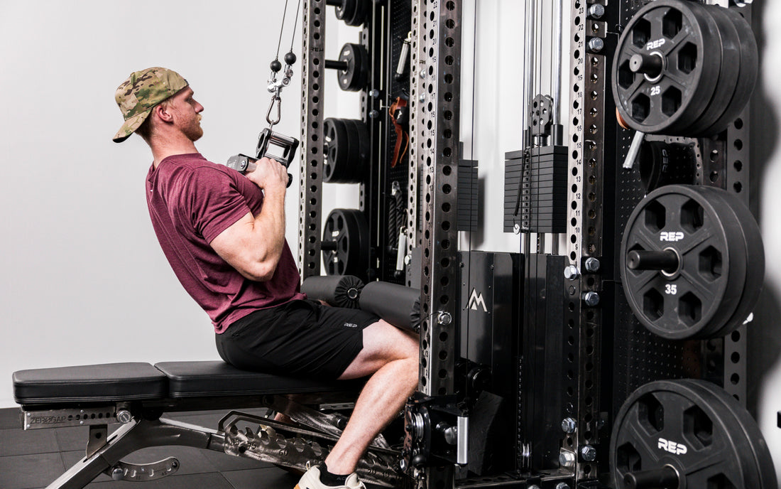 Athlete performing lat pulldowns with a REP® x Kleva Built® Angled Atlas™ Close-Grip Cable and Landmine Attachment