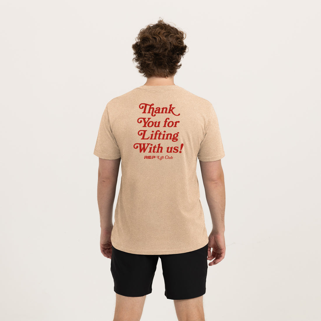 The REP Fitness Lift Club Tri-Blend Crew T-Shirt in Heather Desert/Red back, on model
