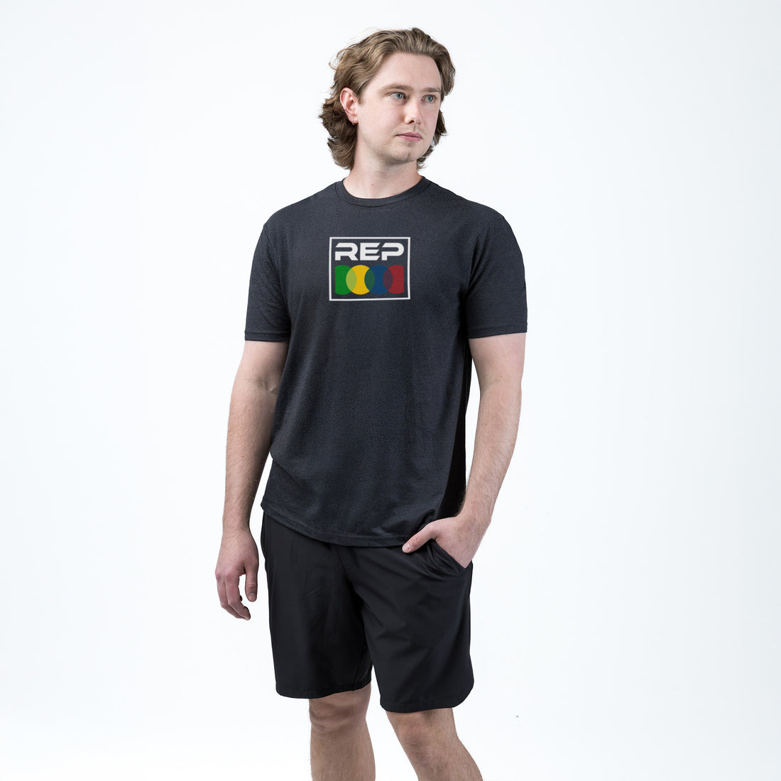Athelete wearing the REP fitness Stacked Tri-Blend Crew T-Shirt in Heather Black/White
