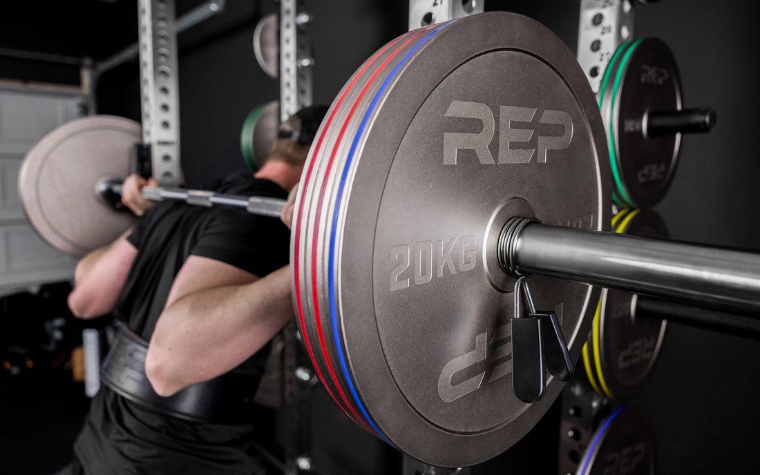 Athlete squatting with Rep Fitness Calibrated Steel Plates (KG), highlighting their thin size and IPF Specs for powerlifting
