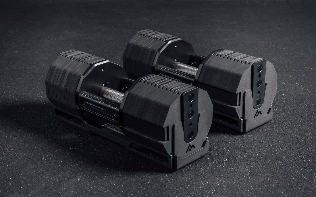 A pair of 125lb REP x PÉPIN FAST Series Adjustable Dumbbells.