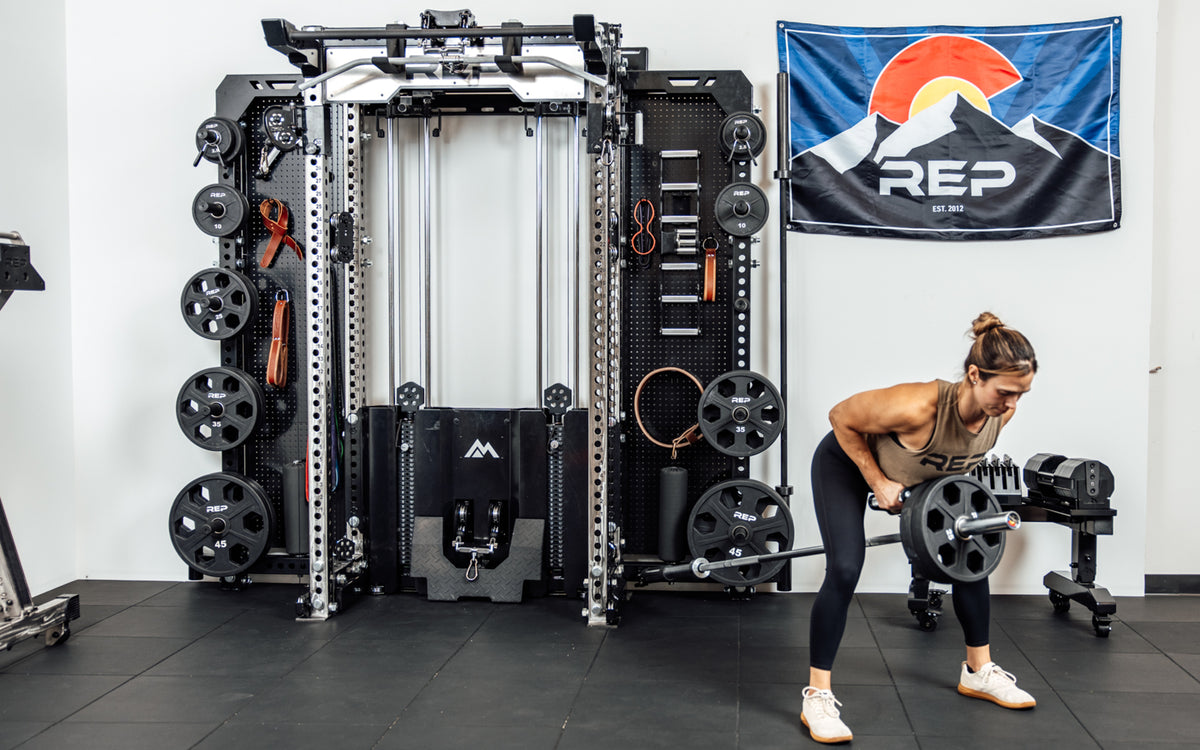 An athlete using the Rack Mounted REP® x Kleva Built® Adroit Landmine to do rows on the Wall-Mounted Ares™ 2.0