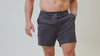 Athlete wearing the REP Fitness Men's Versa Shorts in Heather Black, Heather Cool Gray, Heather Dusty Blue, Slate Blue