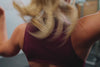 Athlete wearing the REP Fitness Women's Rhea Cropped Tank Top in Black, Wine, Dusk